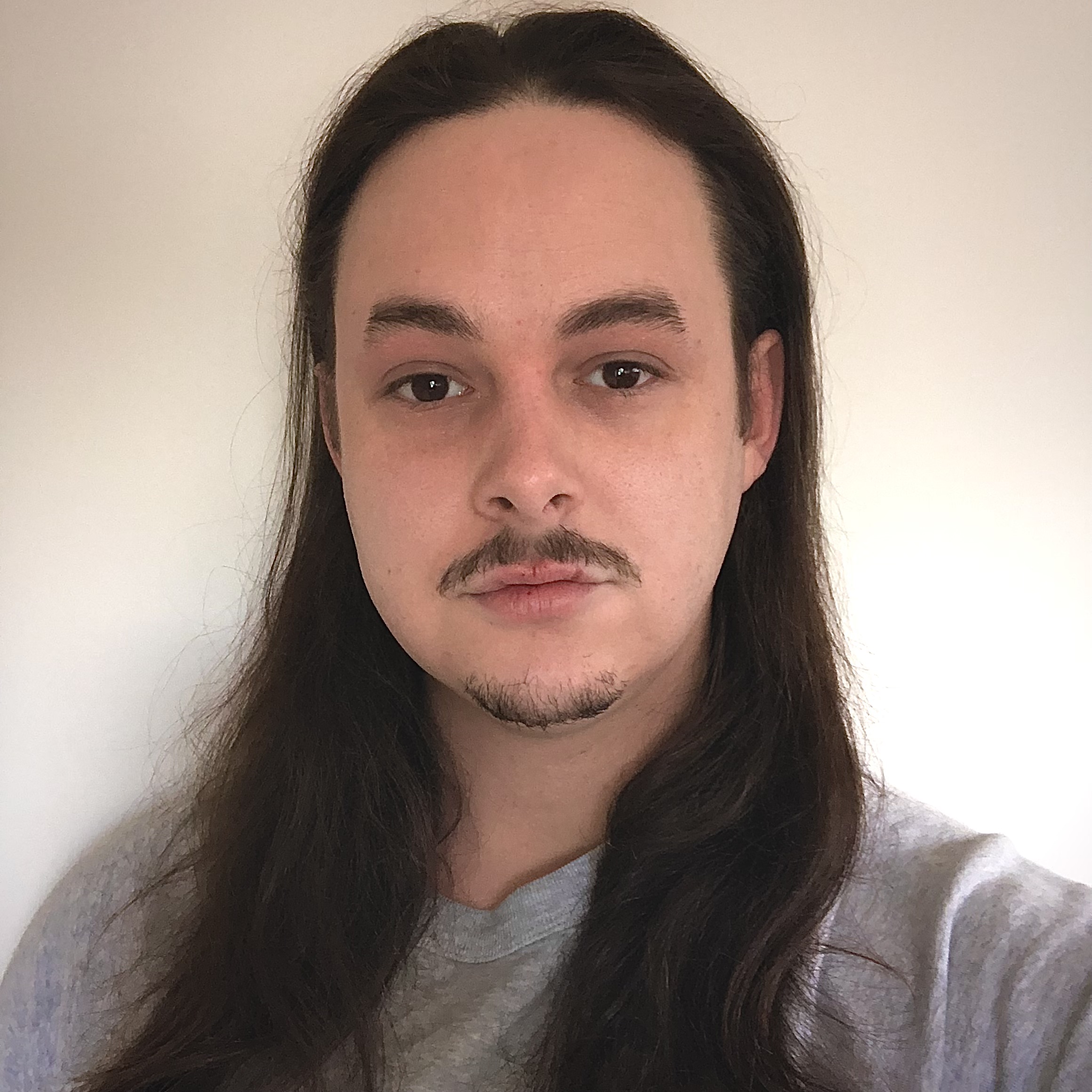 A photo of Jacob within a circular headshot frame